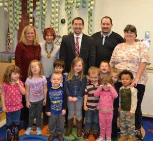 Rep. Jason Ortitay poses for a group photo with staff and children at Blueprints